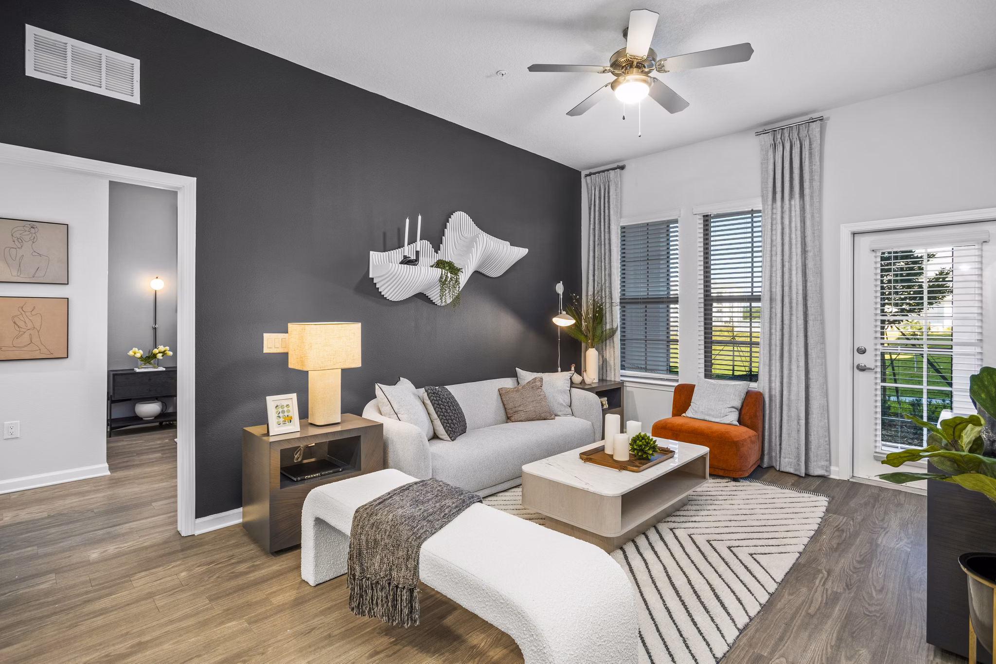 Spacious living room with modern furnishings at Sanctuary at Daytona Apartments