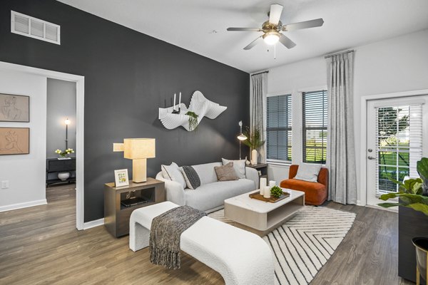 Spacious living room with modern furnishings at Sanctuary at Daytona Apartments