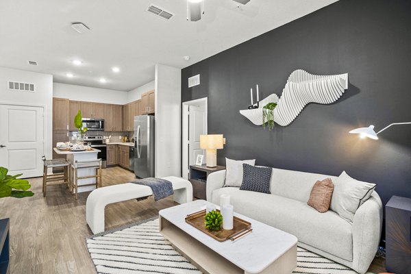 Contemporary living room with modern furnishings at Sanctuary at Daytona Apartments in Daytona Beach
