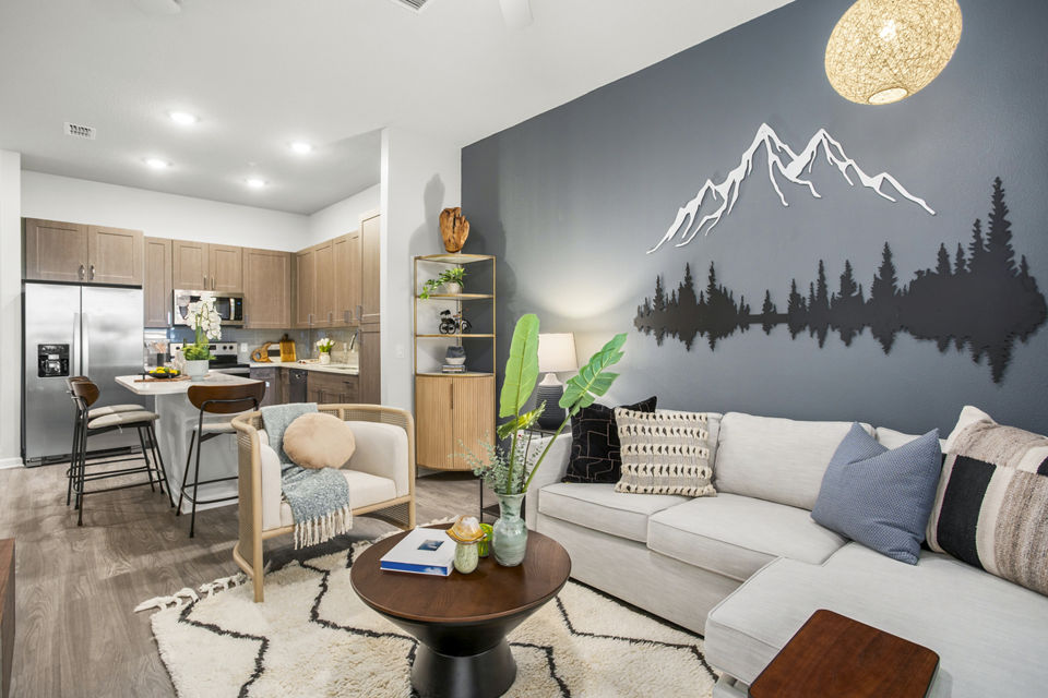 Spacious living room featuring modern decor at Sanctuary at Daytona Apartments