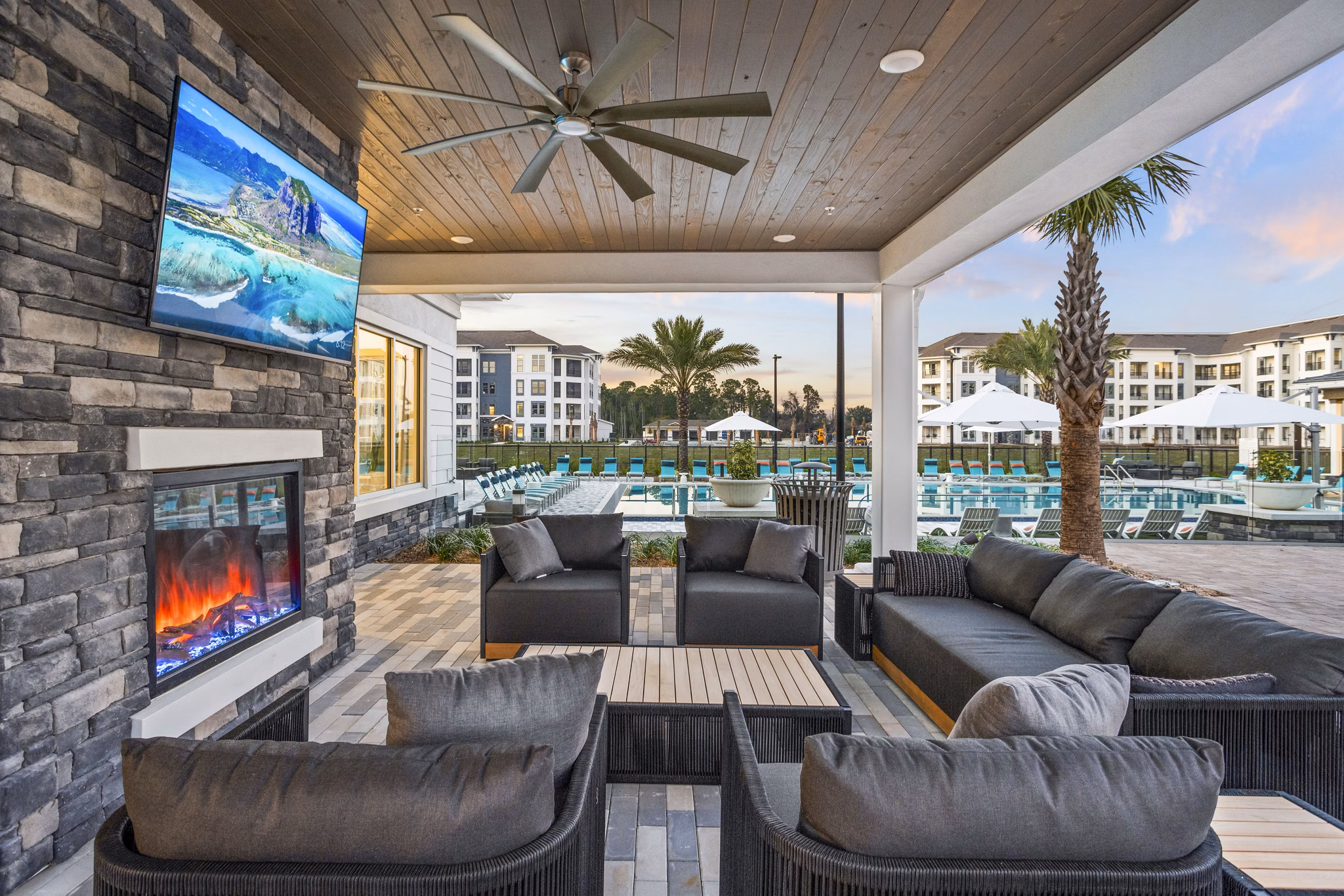 Cozy patio with fire pit at Sanctuary at Daytona Apartments, offering luxurious outdoor living experiences
