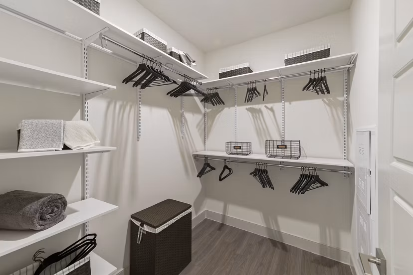 Closet space with custom shelving at The Ian Apartments