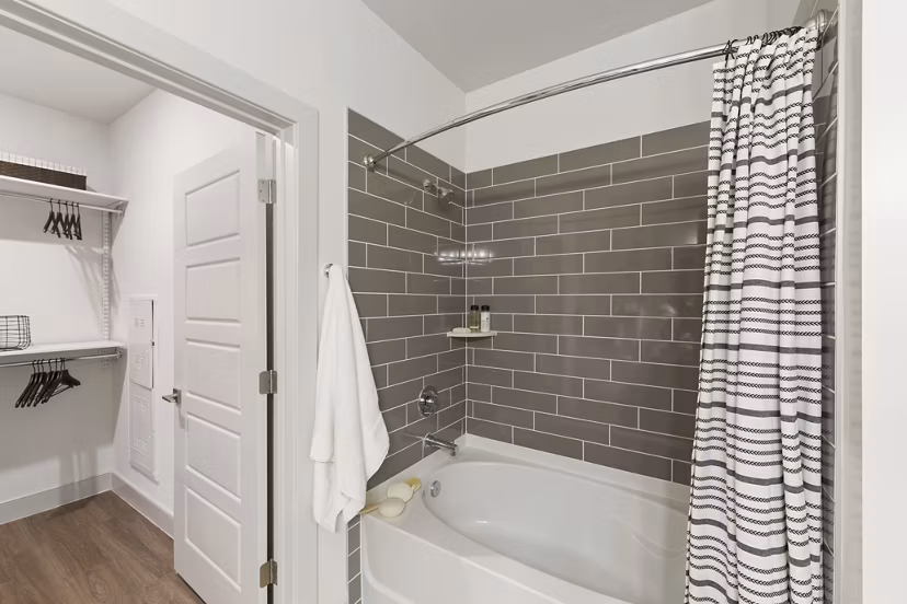 Modern bathroom featuring sleek fixtures and neutral tones at The Ian Apartments