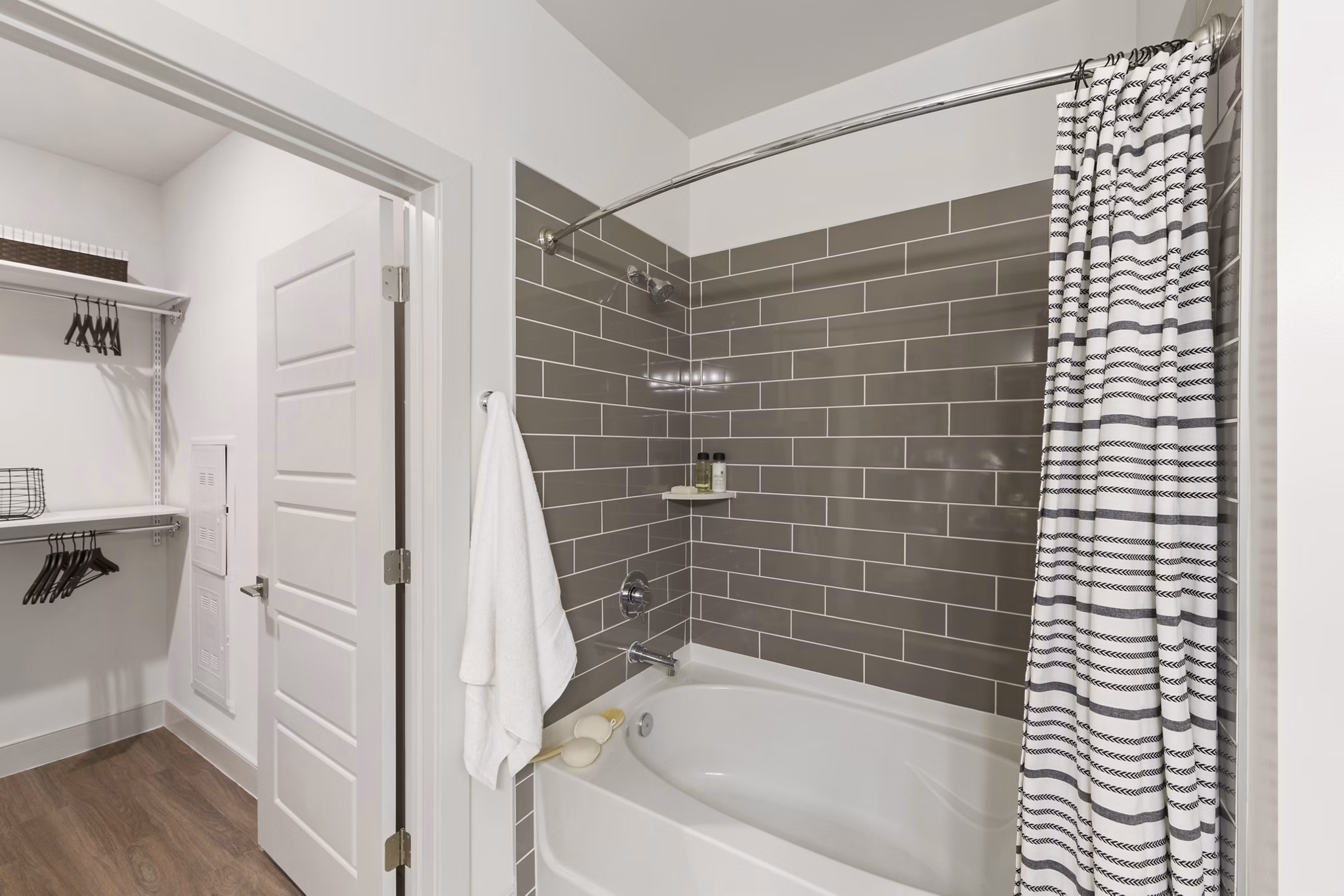 Modern bathroom featuring sleek fixtures and neutral tones at The Ian Apartments