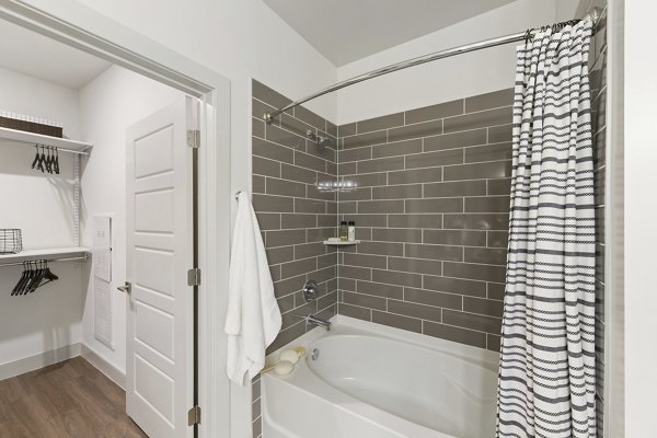 Modern bathroom featuring sleek fixtures and neutral tones at The Ian Apartments