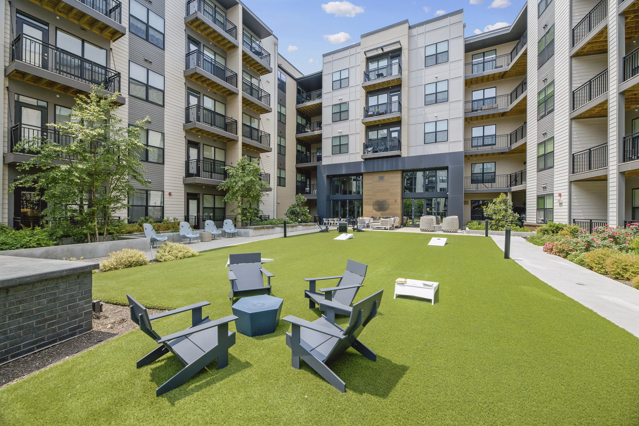 Courtyard with lush landscaping at The Ian Apartments, luxury residential community