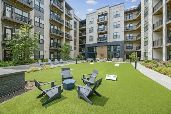 Courtyard with lush landscaping at The Ian Apartments, luxury residential community