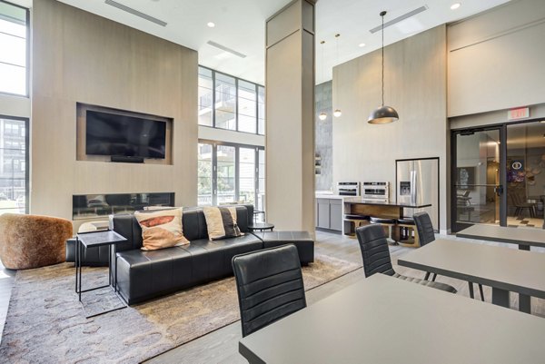 Clubhouse featuring modern design and plush seating at The Ian Apartments, a Greystar luxury community