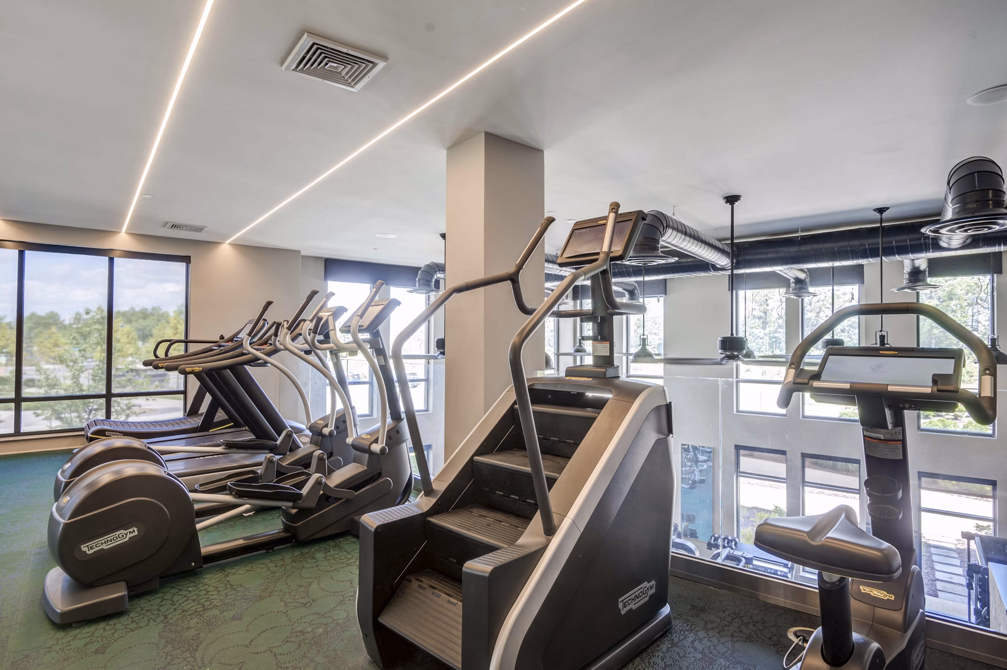 Fitness center with modern equipment at The Ian Apartments in luxury Greystar community