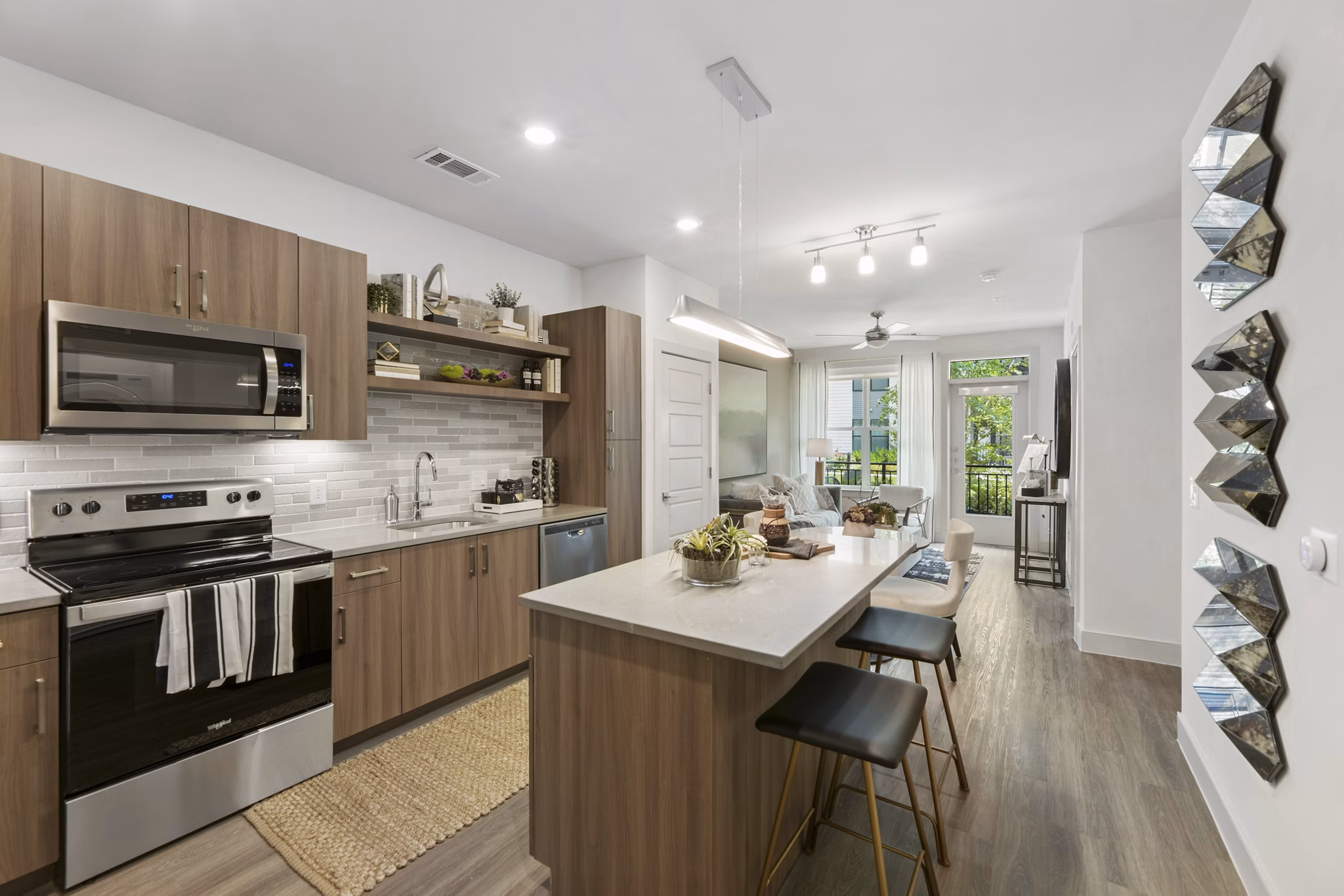 Modern kitchen with stainless steel appliances at The Ian Apartments, luxury living in the heart of the city
