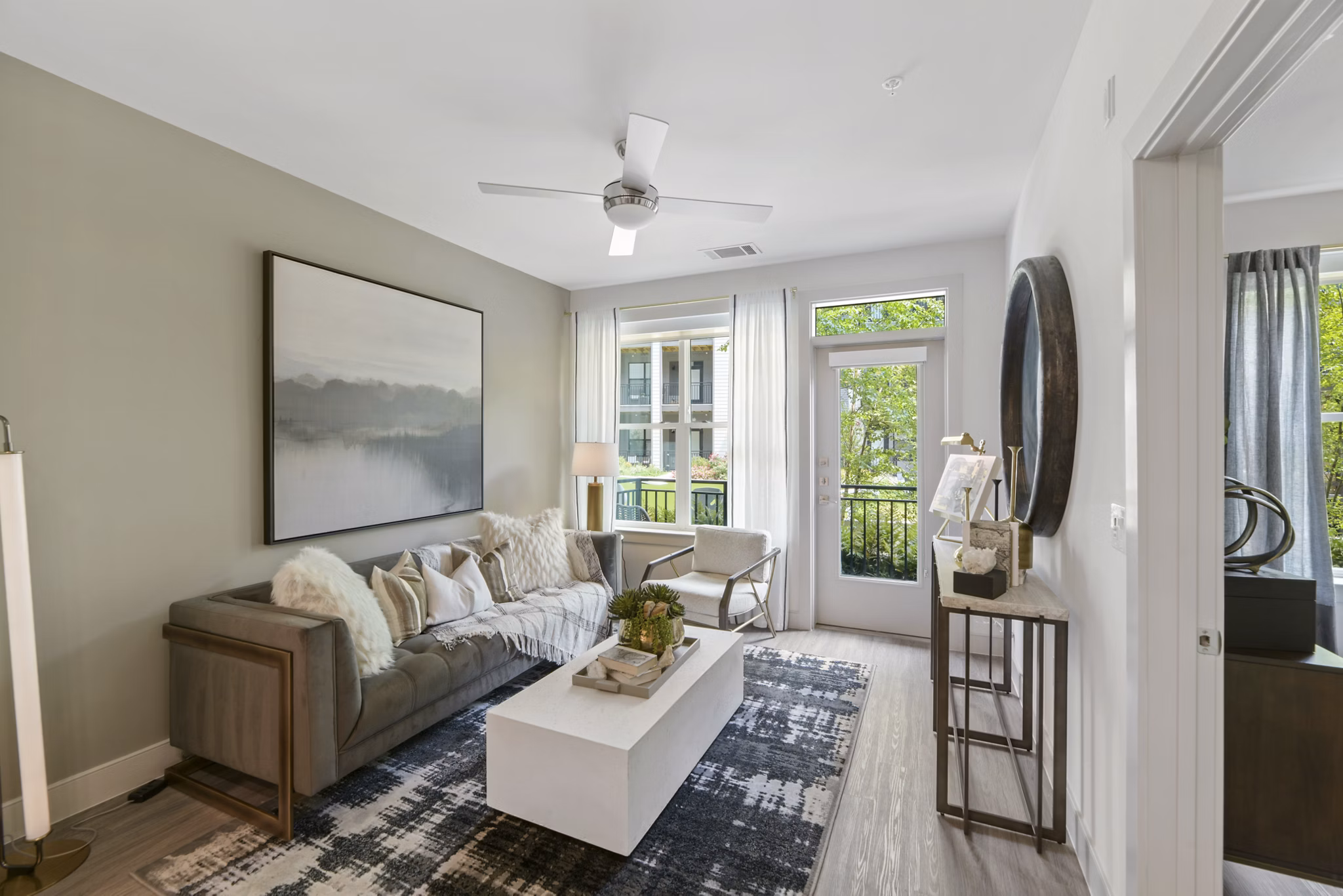 Spacious living room with modern dÃ©cor in The Ian Apartments, luxury high-rise by Greystar