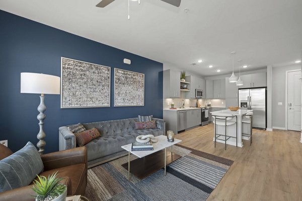 living room at Alexan Mill District Apartments 