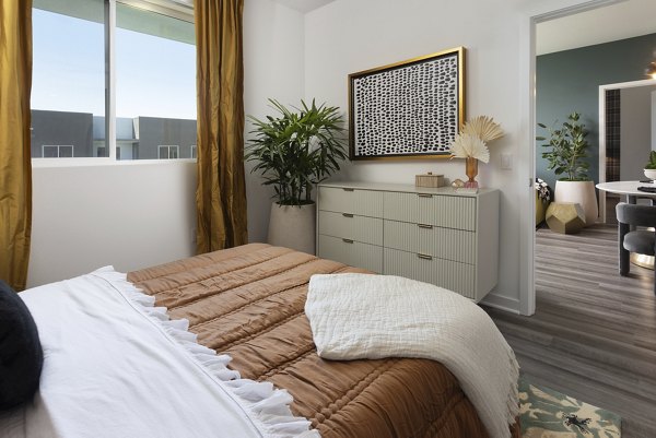 Cozy bedroom with modern decor at Broadstone Edition Apartments, offering luxury living experiences