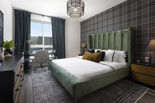 Spacious bedroom with modern decor and large windows at Broadstone Edition Apartments