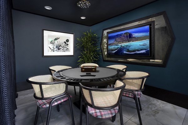 Stylish game room with pool table and vibrant decor at Broadstone Edition Apartments