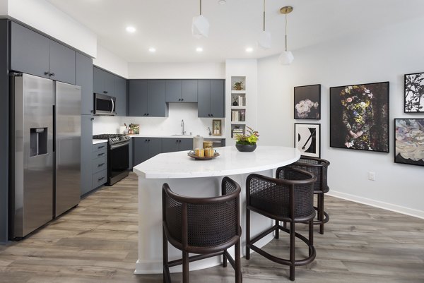 Modern kitchen with stainless steel appliances at Broadstone Edition Apartments