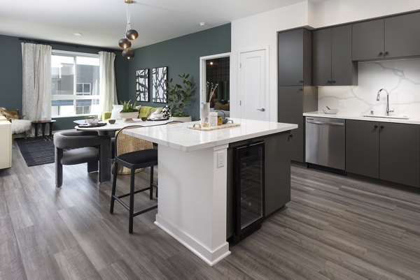 Modern kitchen with stainless steel appliances at Broadstone Edition Apartments