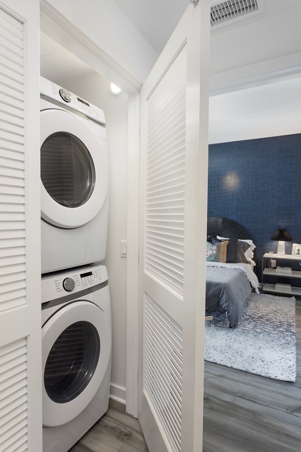 Laundry room featuring modern washers and dryers at Broadstone Edition Apartments