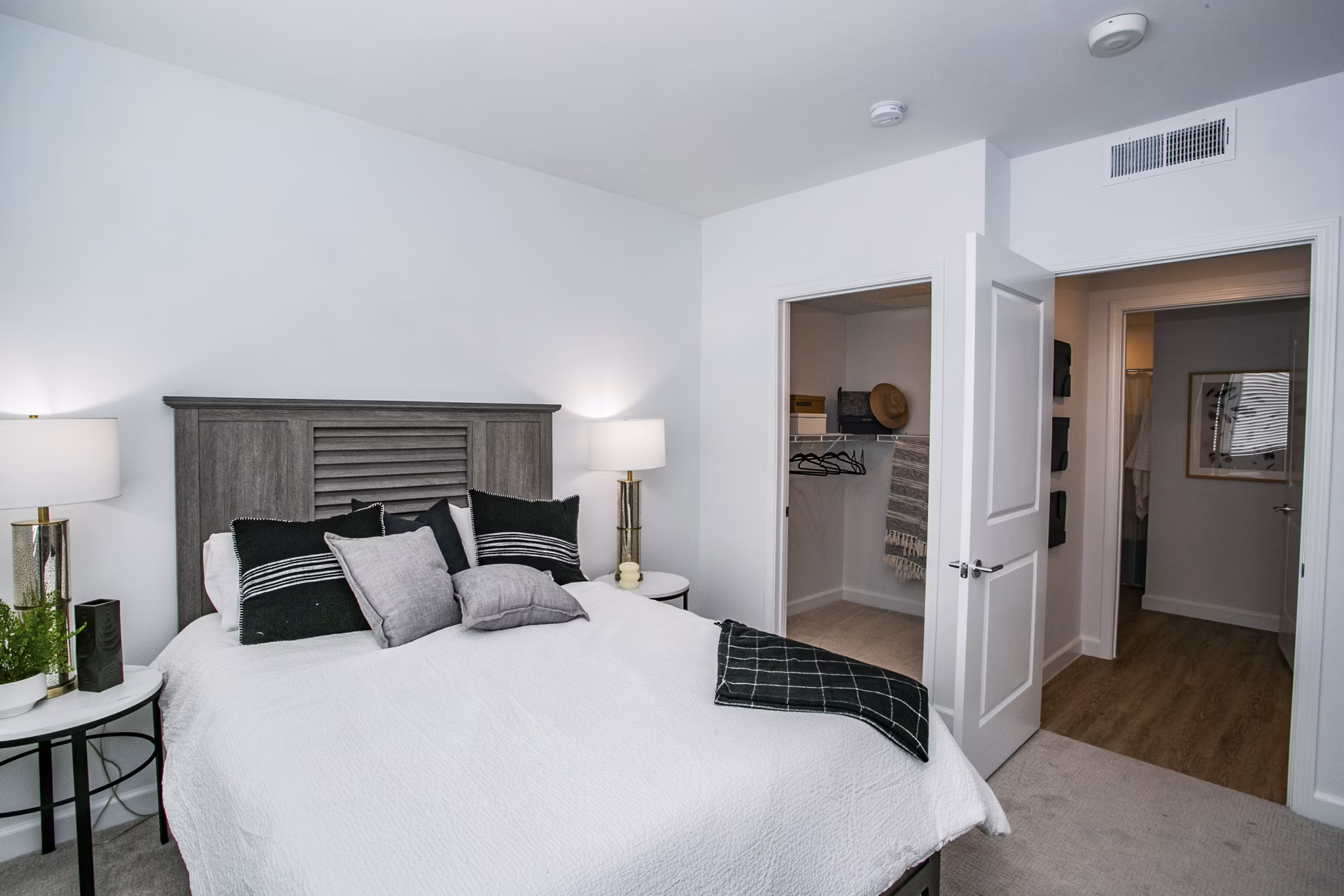 Spacious bedroom featuring modern decor at The Apex @ Meadows Apartments