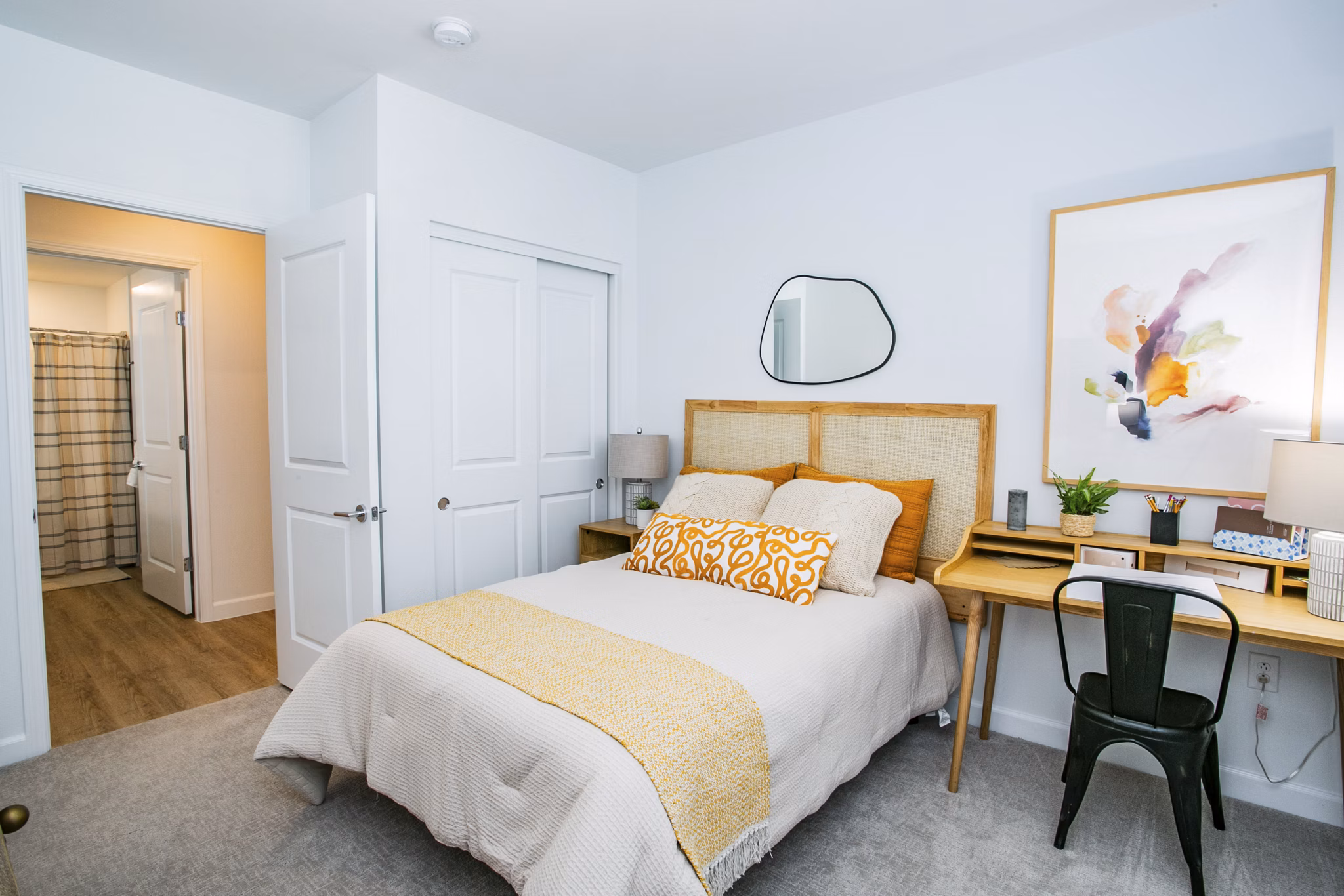 Cozy bedroom with modern decor at The Apex @ Meadows Apartments, offering luxury living in a serene setting