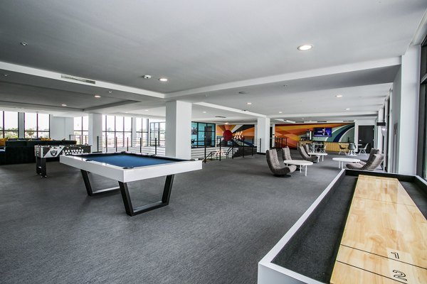 Luxurious clubhouse featuring modern furnishings at The Apex @ Meadows Apartments