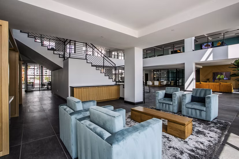 Clubhouse featuring modern design and leisure facilities at The Apex at Meadows Apartments