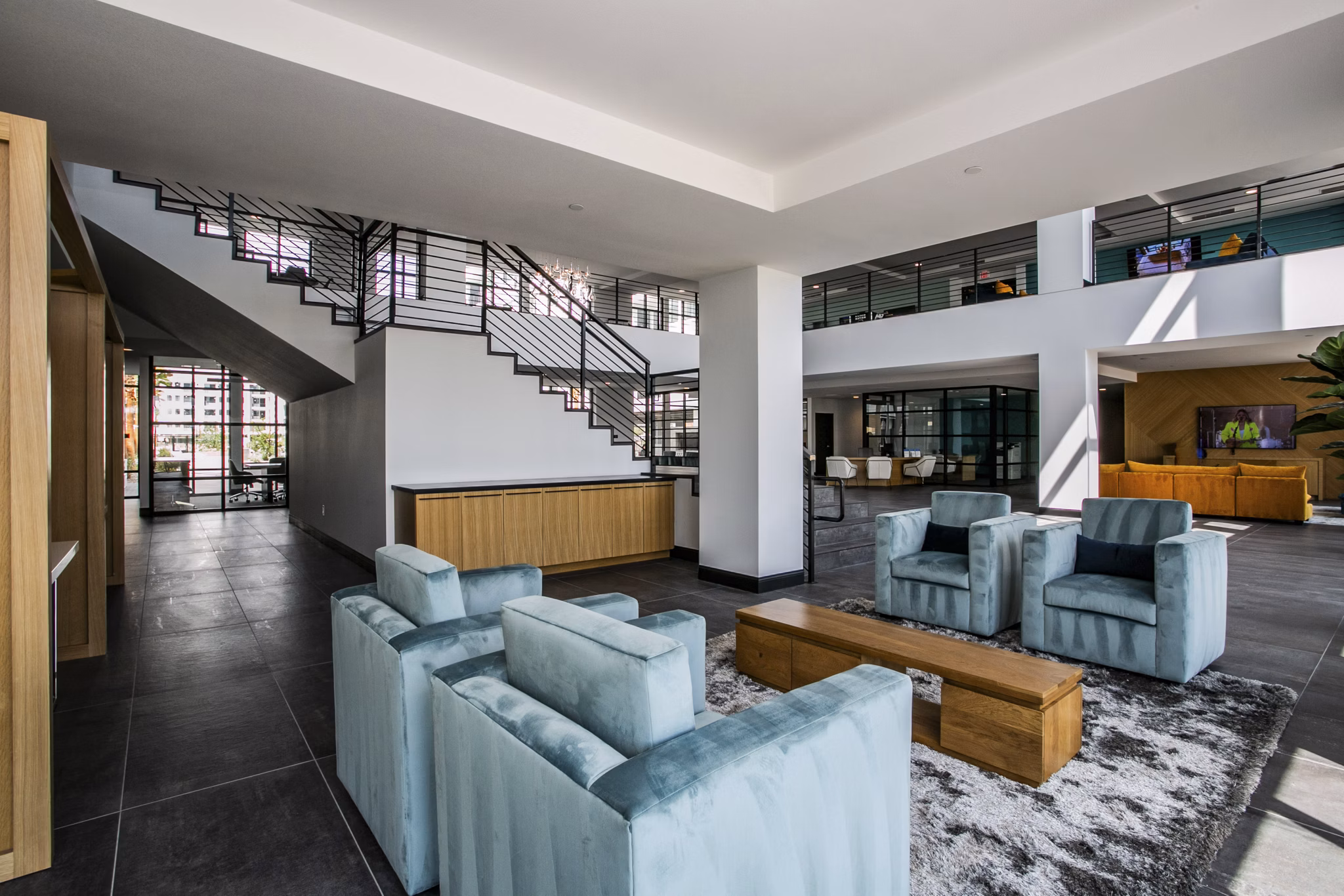 Clubhouse featuring modern design and leisure facilities at The Apex at Meadows Apartments