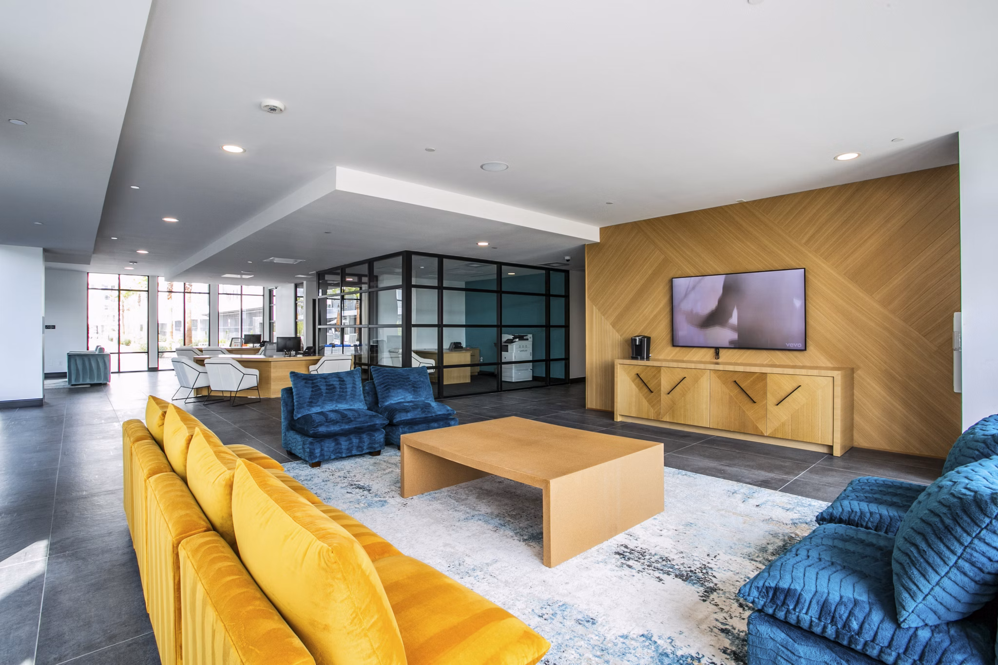 Clubhouse at The Apex @ Meadows Apartments with modern design and spacious seating, perfect for community events and gatherings