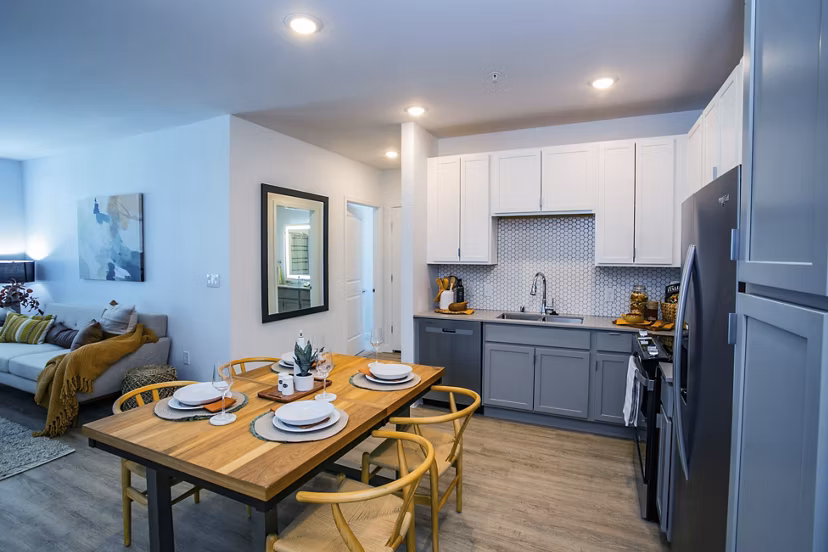 Modern dining area with sleek furnishings at theApex @ Meadows Apartments, offering luxury living and high-end amenities
