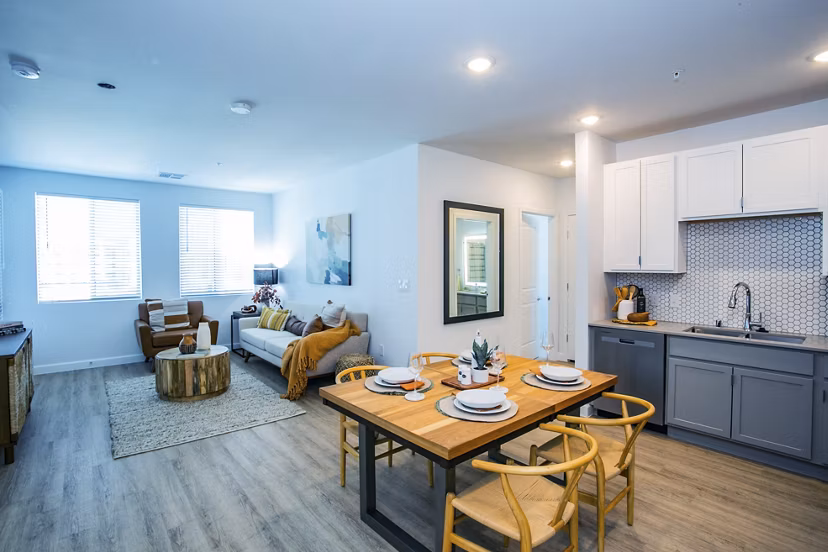 Dining area with modern furnishings and sleek design at The Apex @ Meadows Apartments