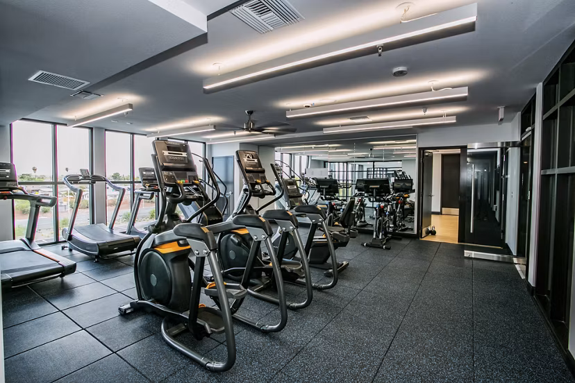 State-of-the-art fitness center with modern equipment at theApex @ Meadows Apartments
