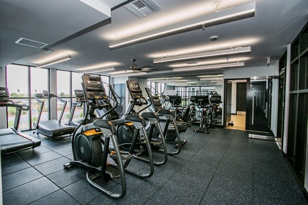 State-of-the-art fitness center with modern equipment at theApex @ Meadows Apartments
