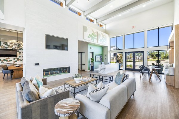 Clubhouse lobby featuring modern seating and elegant decor at Birchway Spring Cypress Apartments