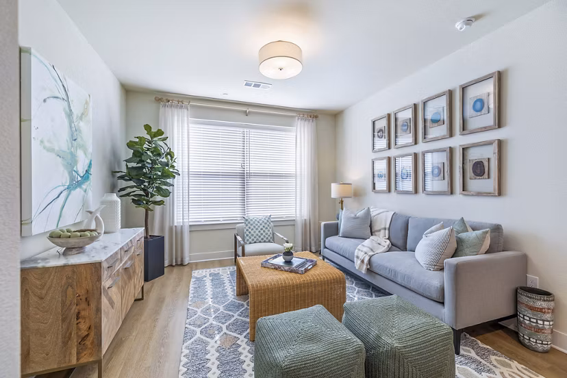 Spacious living room with modern decor and natural lighting in Birchway Spring Cypress Apartments