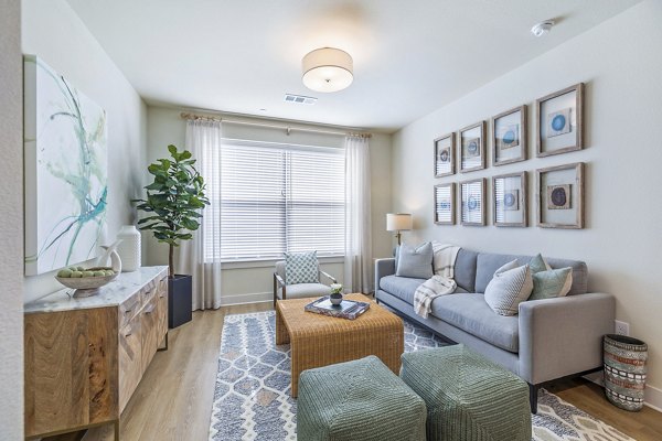 Spacious living room with modern decor and natural lighting in Birchway Spring Cypress Apartments
