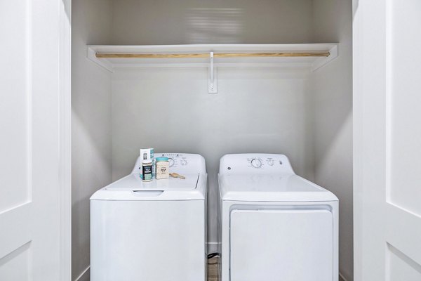 laundry room at Birchway Spring Cypress Apartments