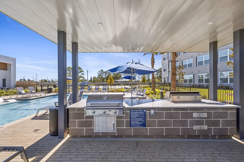 Grill and outdoor patio area at Birchway Spring Cypress Apartments, luxury living with modern amenities