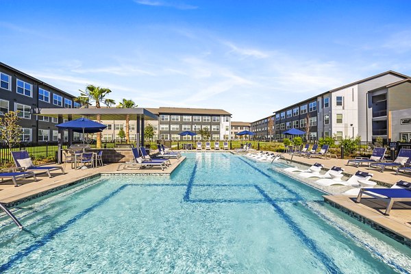 Refreshing outdoor pool at Birchway Spring Cypress Apartments offering relaxation and leisure in a serene environment