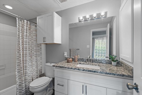 Modern bathroom featuring sleek fixtures at Madison at Melrose Apartments