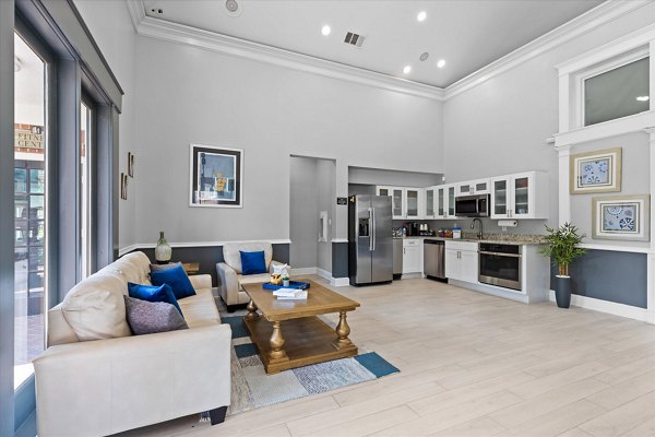 Spacious clubhouse with modern furnishings at Madison at Melrose Apartments