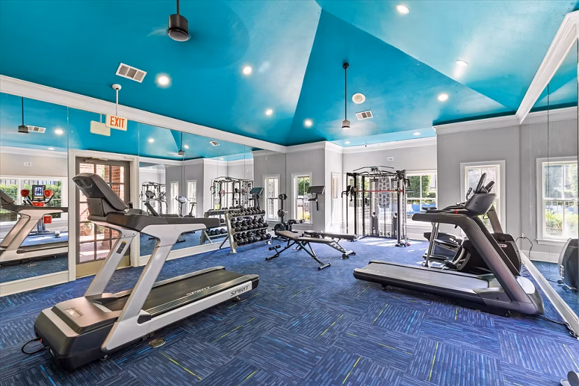 State-of-the-art fitness center at Madison at Melrose Apartments featuring modern workout equipment and open floor plan for active lifestyles