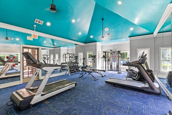 State-of-the-art fitness center at Madison at Melrose Apartments featuring modern workout equipment and open floor plan for active lifestyles