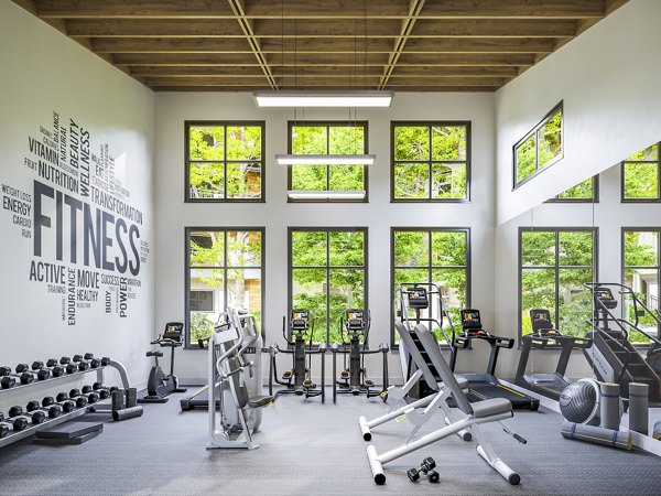 Fitness center with state-of-the-art equipment at Traverse Apartments, offering a modern workout environment