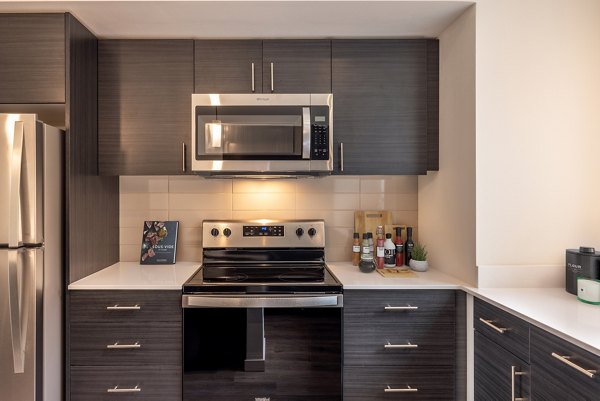 Kitchens featuring modern appliances and sleek design in Traverse North Bend Apartments