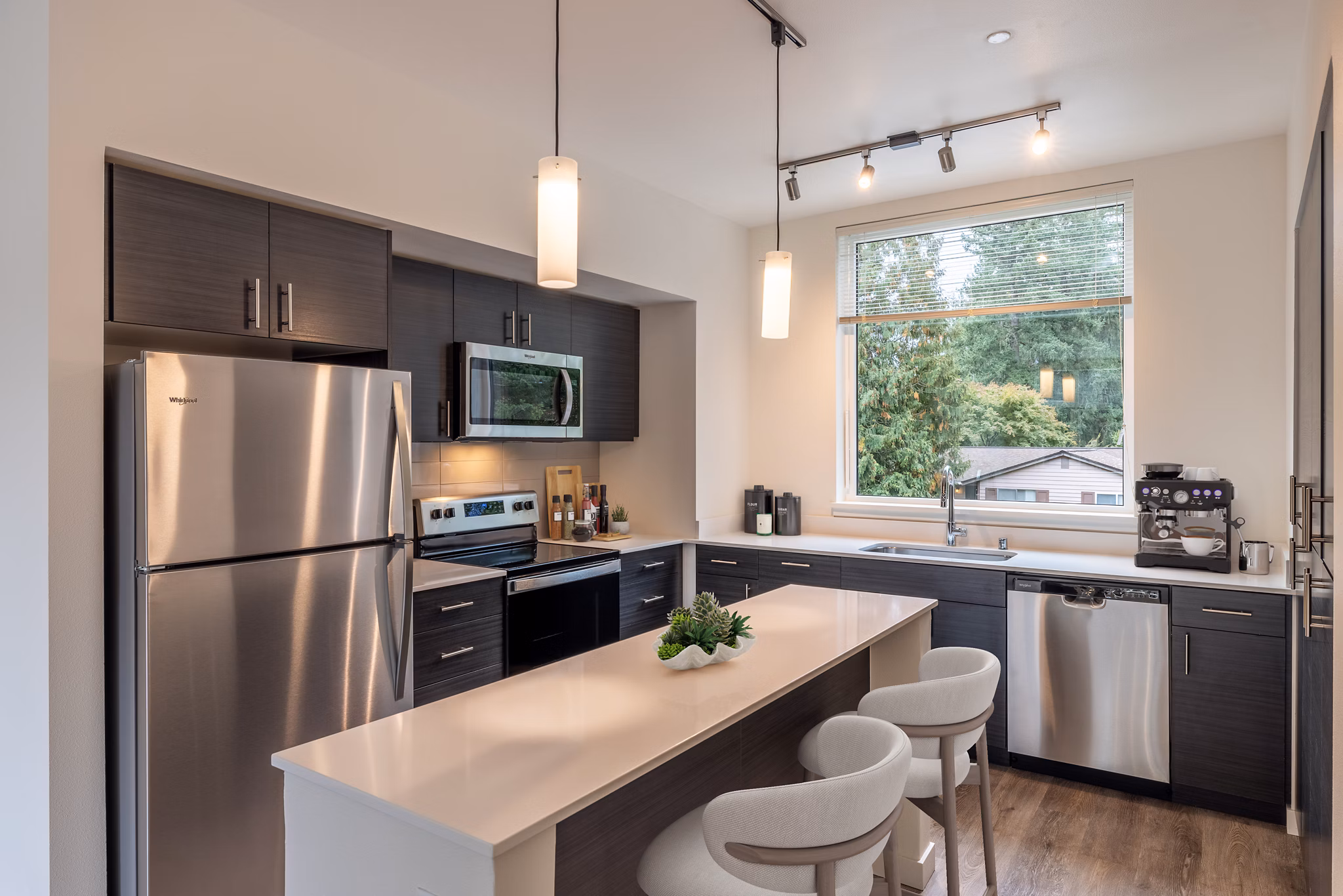 Kitchen with modern appliances and granite countertops at Traverse North Bend Apartments