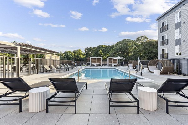 Resort-style pool with lounging areas at Sanctuary at Winchester North Apartments