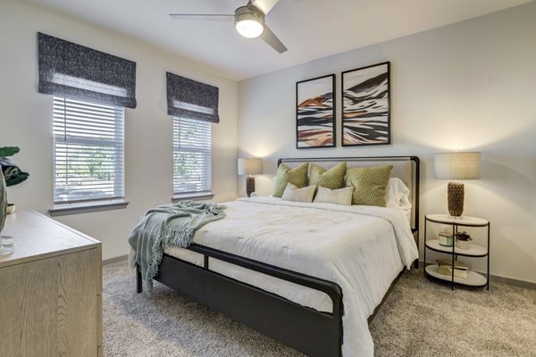 Luxurious bedroom with modern decor at Inscribe Apartments