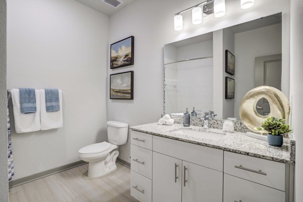 Modern bathroom with sleek fixtures at Inscribe Apartments, offering luxury living and contemporary design