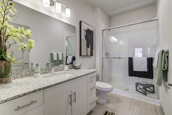 Bathroom featuring sleek fixtures and modern design at Inscribe Apartments, Greystar luxury apartments