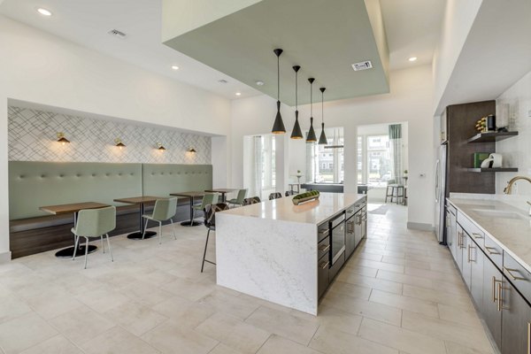Elegant clubhouse with cozy seating and modern design at Inscribe Apartments, offering luxury amenities for residents to enjoy leisure and social activities